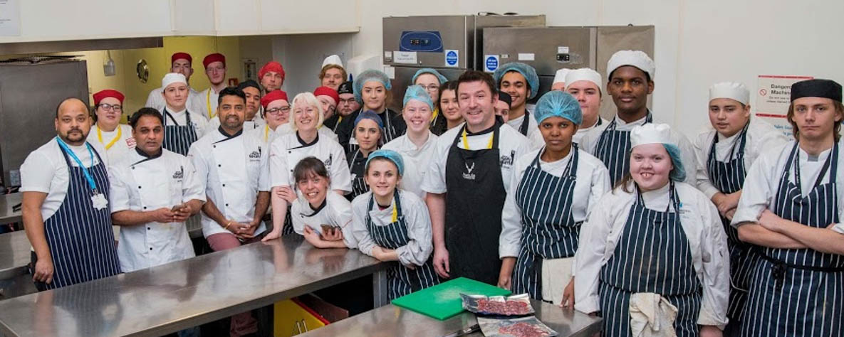 Group of young people with high-skilled chefs.