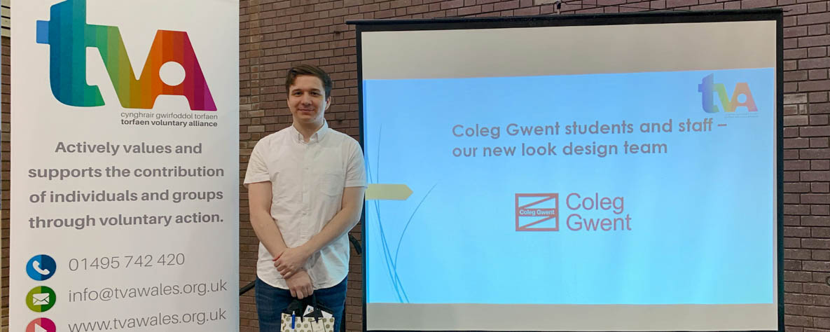Coleg Gwent Student presenting design made for the Torfaen Voluntary Alliance.