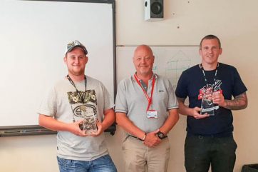 Staff holding awards