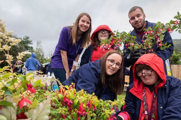 Group of people working in the garden