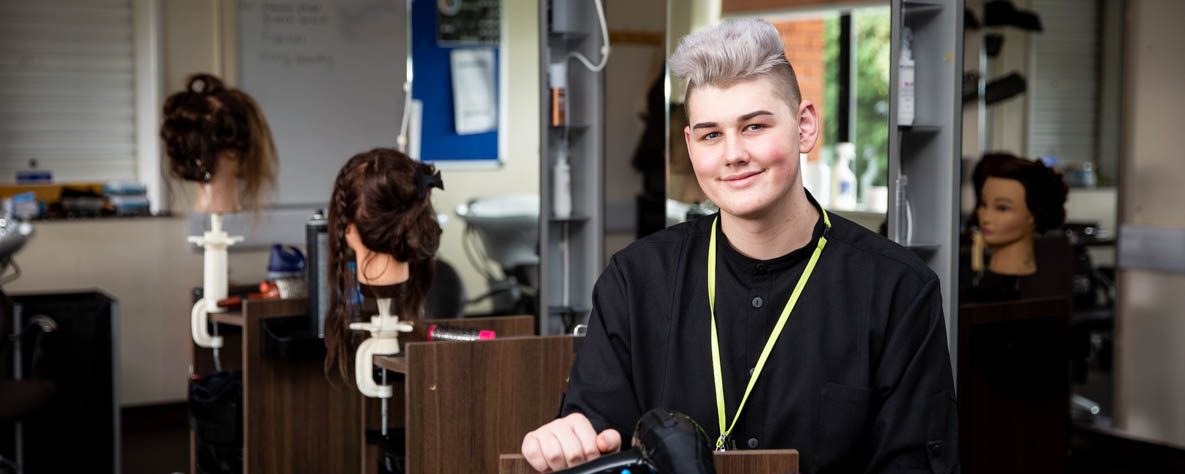 Hairdressing student in salon
