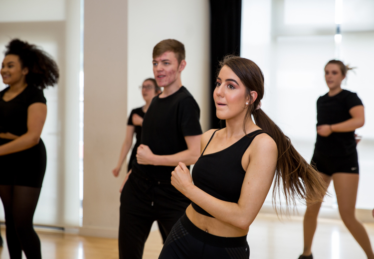 students dancing in rehearsal room