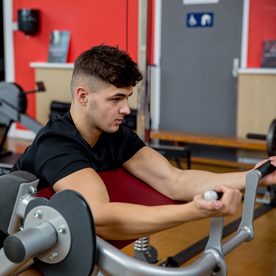 man using gym equipment