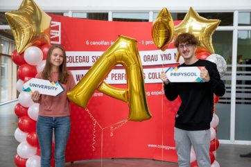 Learners with gold A star balloons