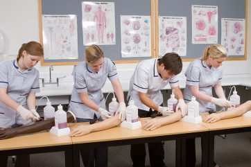 Healthcare learners using training arms