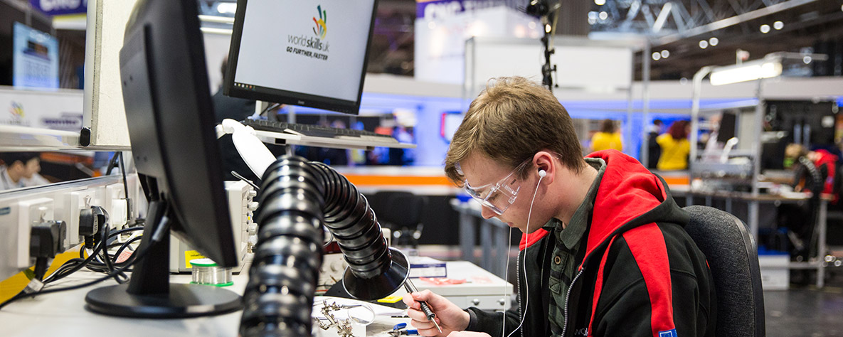 WorldSkills learner soldering a circuit board