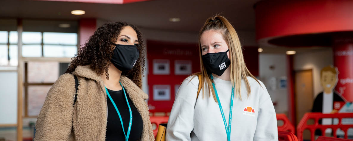 Coleg Gwent care students wearing Coleg Gwent masks