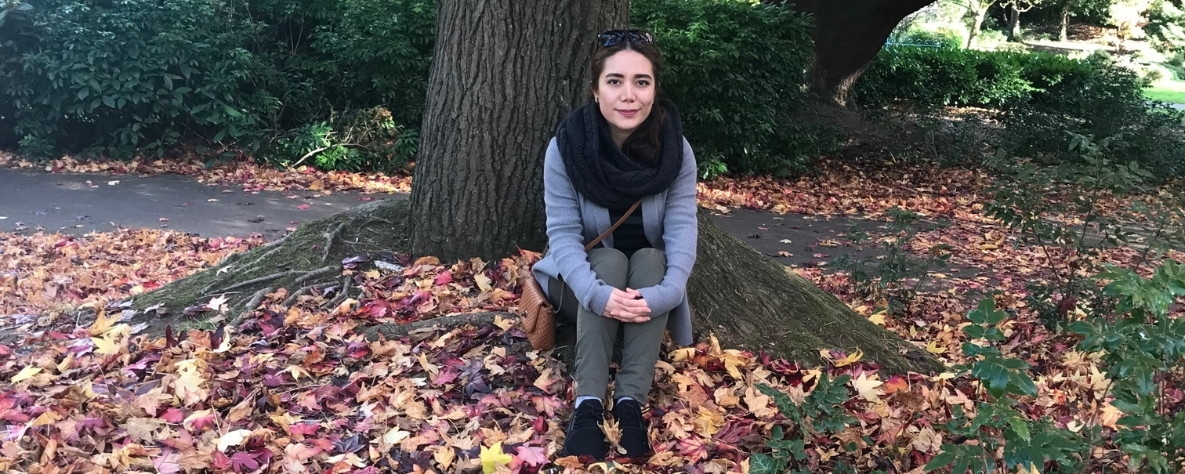 Melika Ghorbankhani sitting in a local park