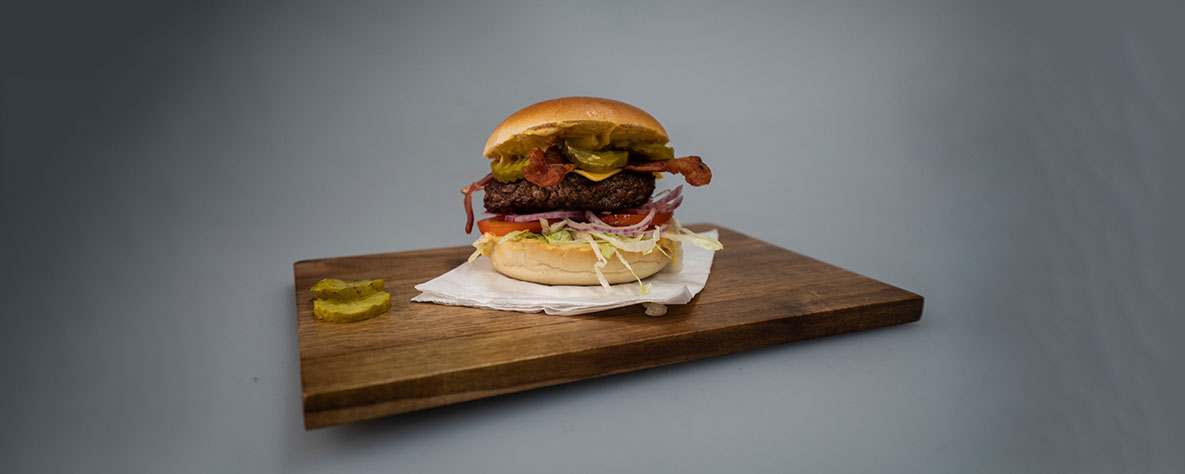 Burger on a wooden platter