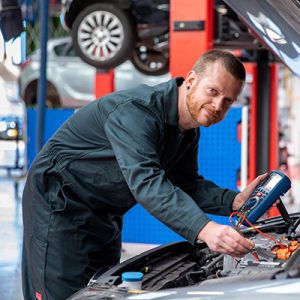 Kai Griffiths working on a car