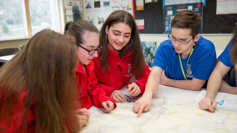 Public services learners reading a map