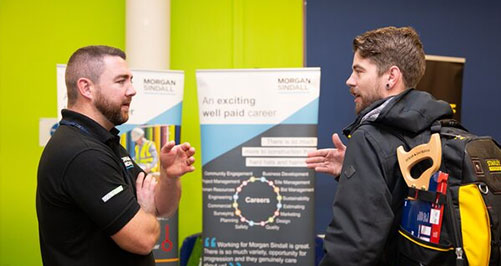 10-employability Student talking to employer