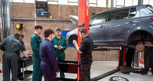 Students working on car