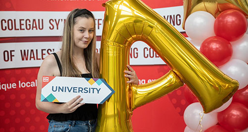 Student with gold A balloon