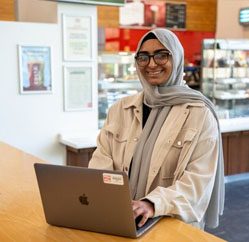 Aneesa, ICT student on laptop