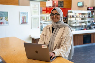 Aneesa, ICT student on laptop