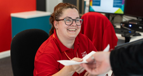 Member of staff smiling