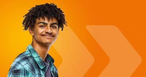 Student wearing a checked shirt on an orange background