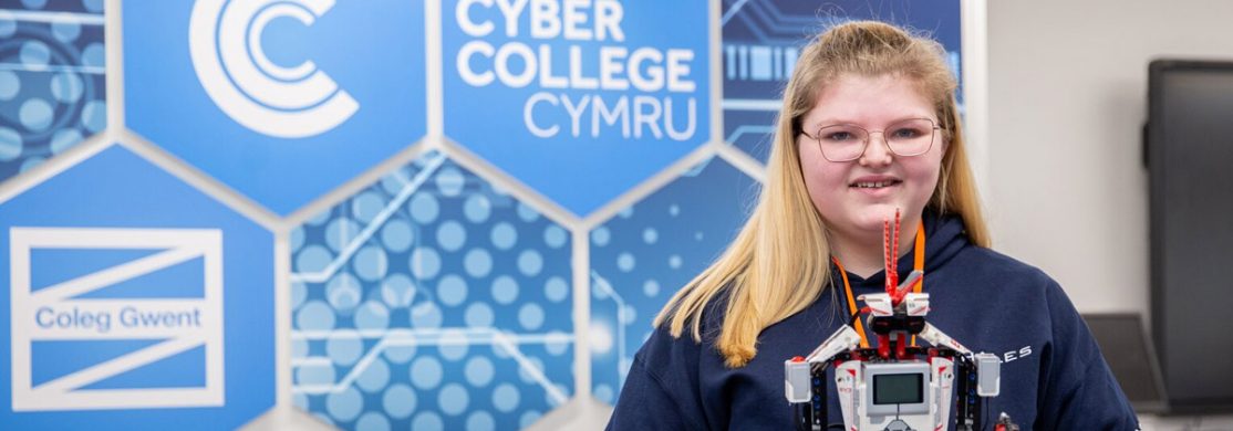 full-time-cyber-social Cyber College Cymru student holding a robot