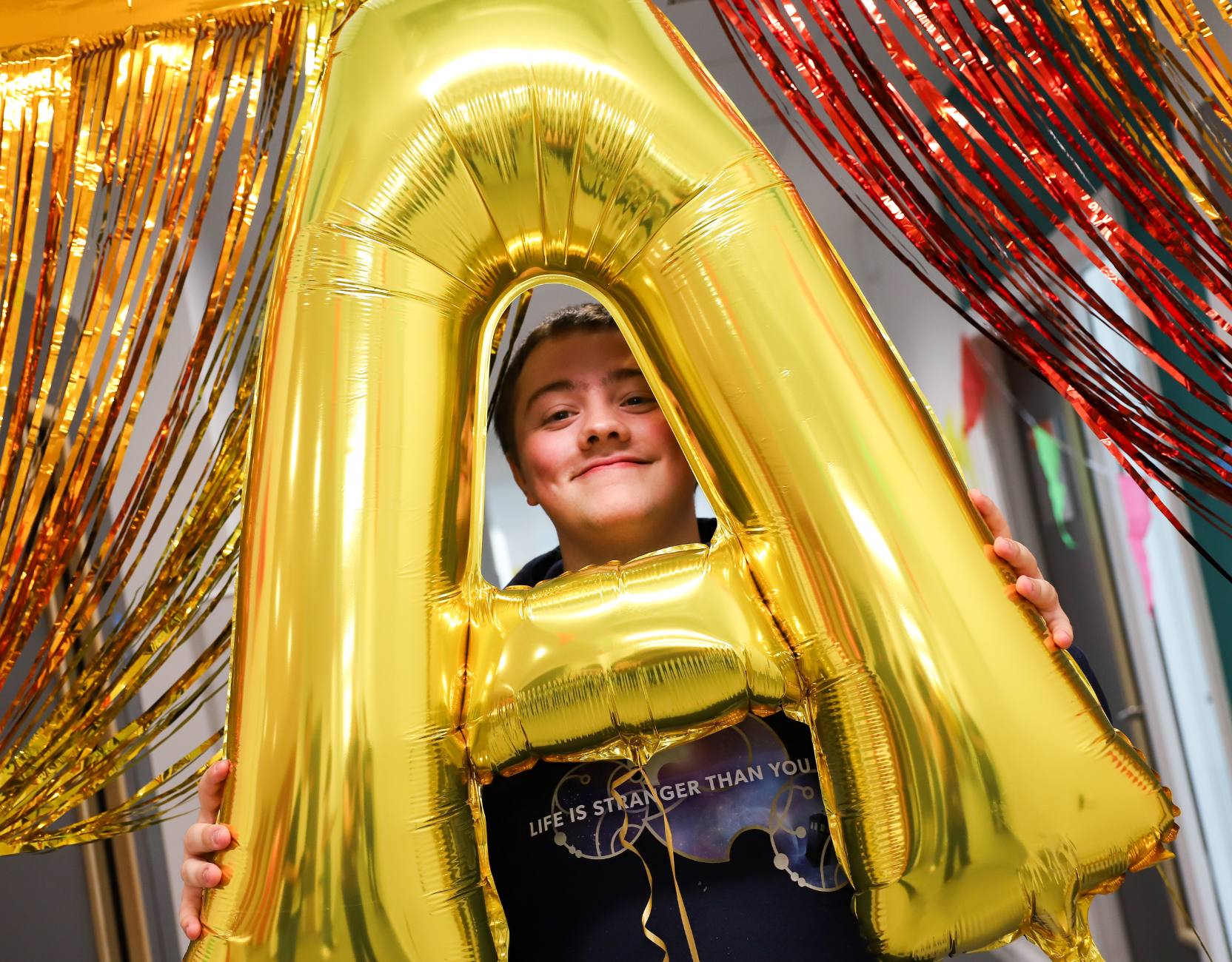 Learner holding A balloon