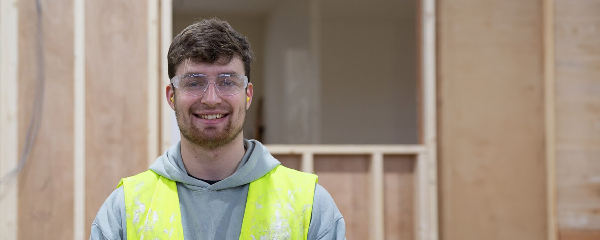 Apprentice wearing hi vis