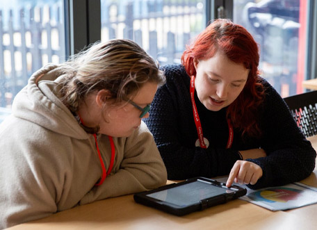 Student getting help from a member of staff