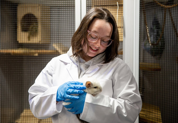 Student with guinea pig