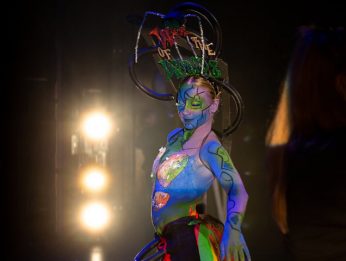 Student on stage with body paint