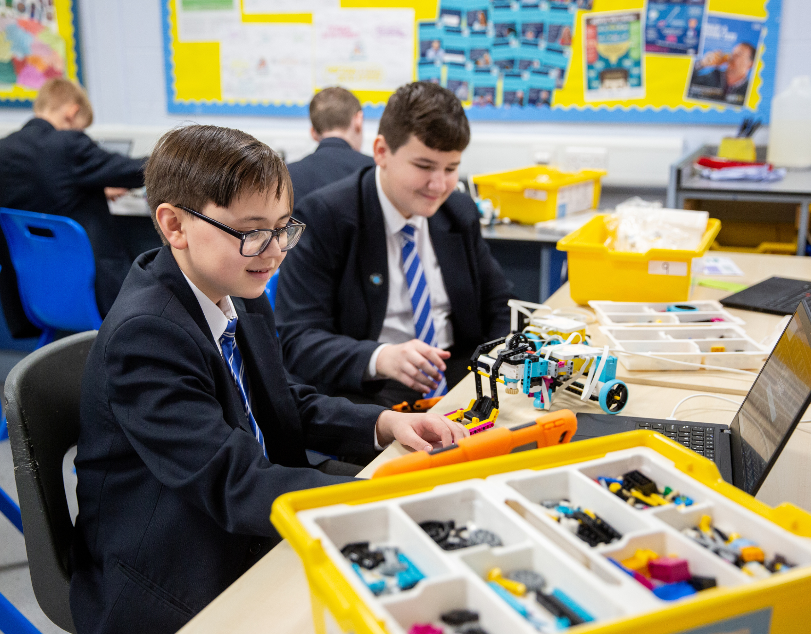 School children using engineering equipment