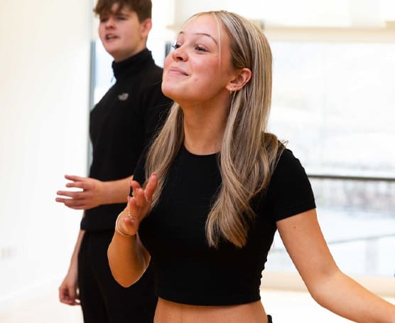 Student performing in dance studio