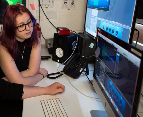 Students in media editing suite