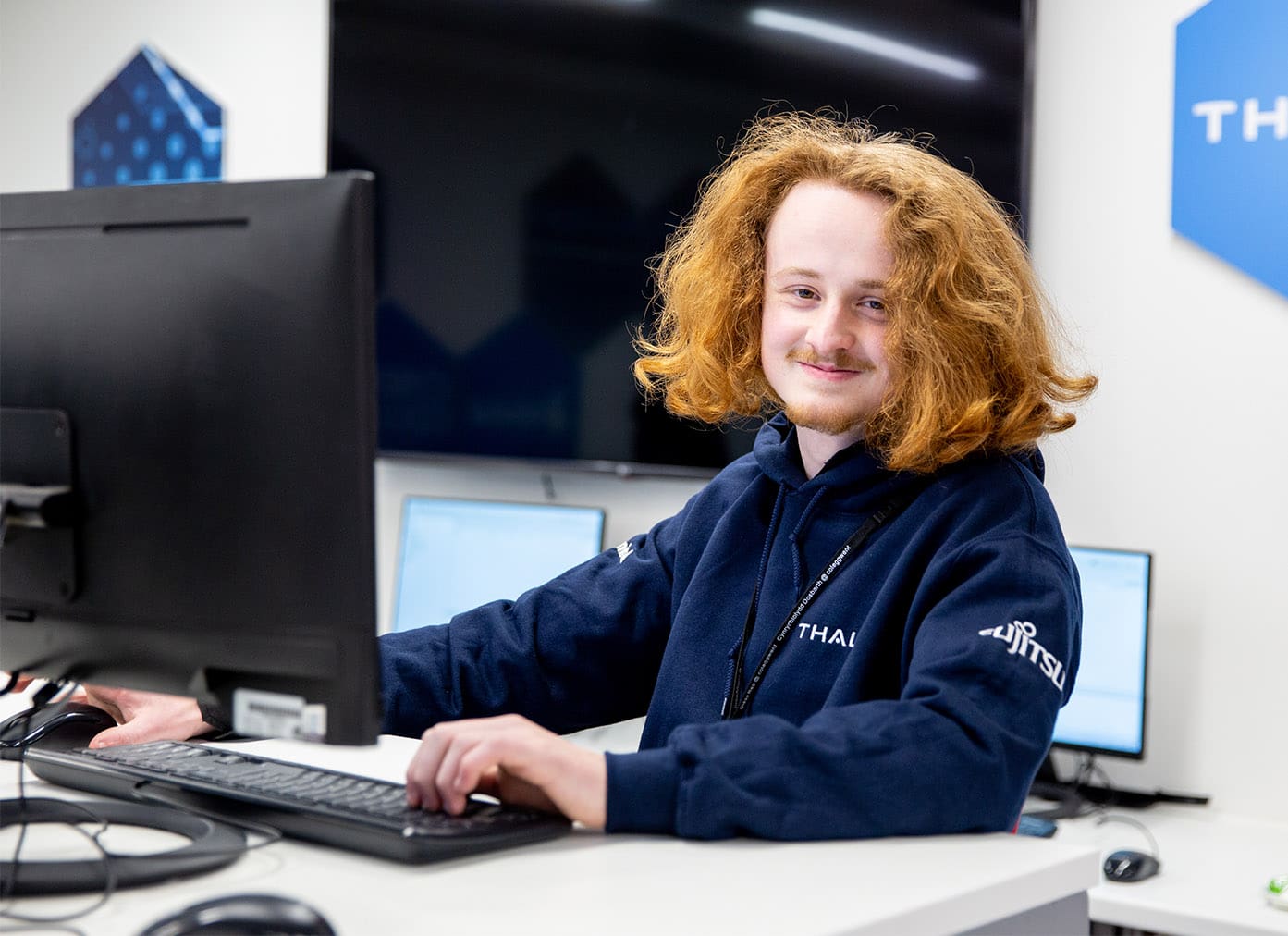 Computing student sat in the Cyber Hub at BGLZ