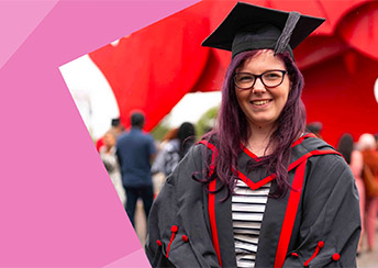 Student wearing gown at graduation