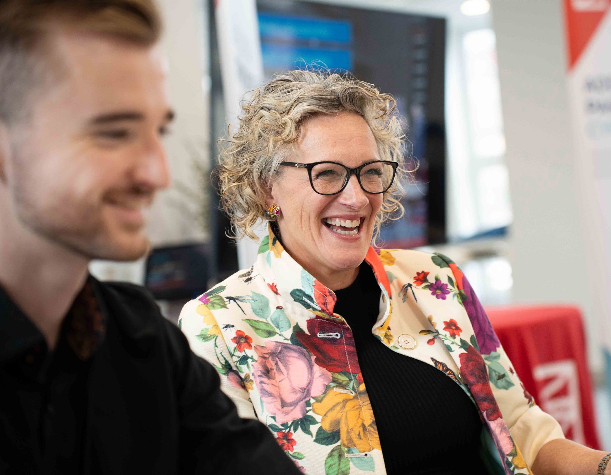 People laughing at an employer network event