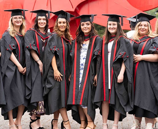 Group of Coleg Gwent graduates at graduation ceremony