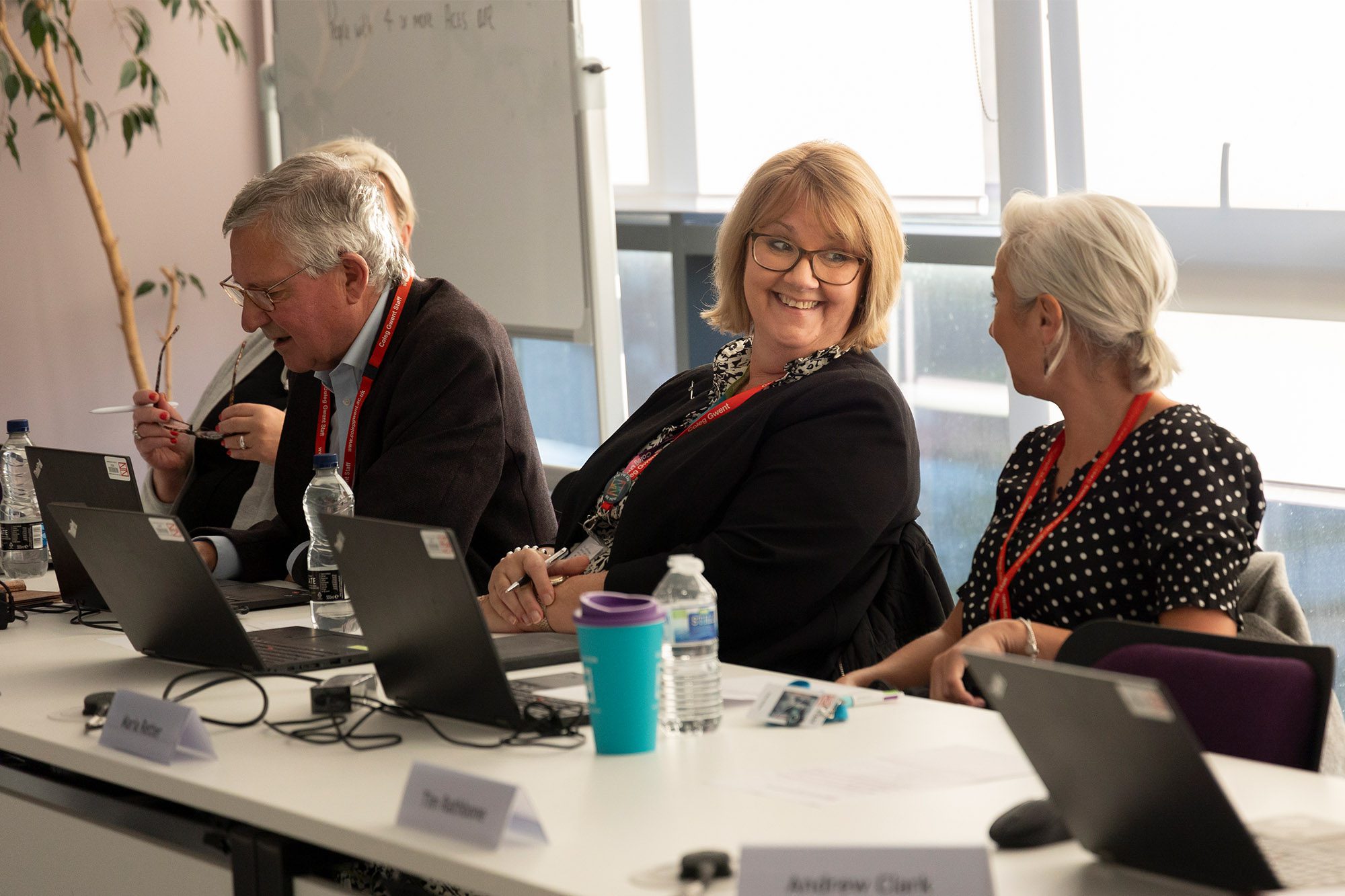 Governors smiling in a meeting