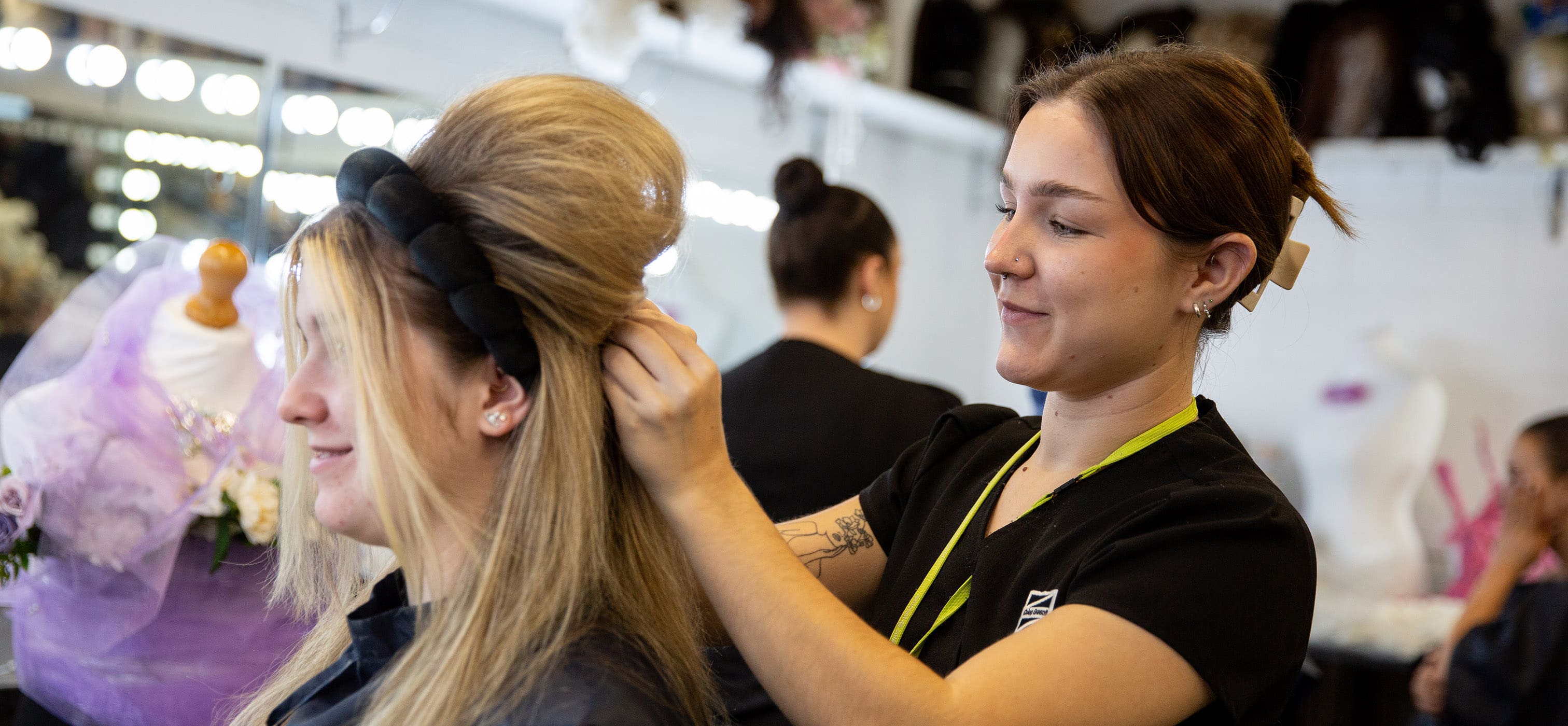 Hairdressing student working backstage