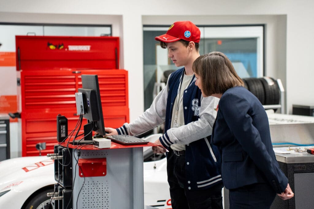 Learner showing information on a monitor