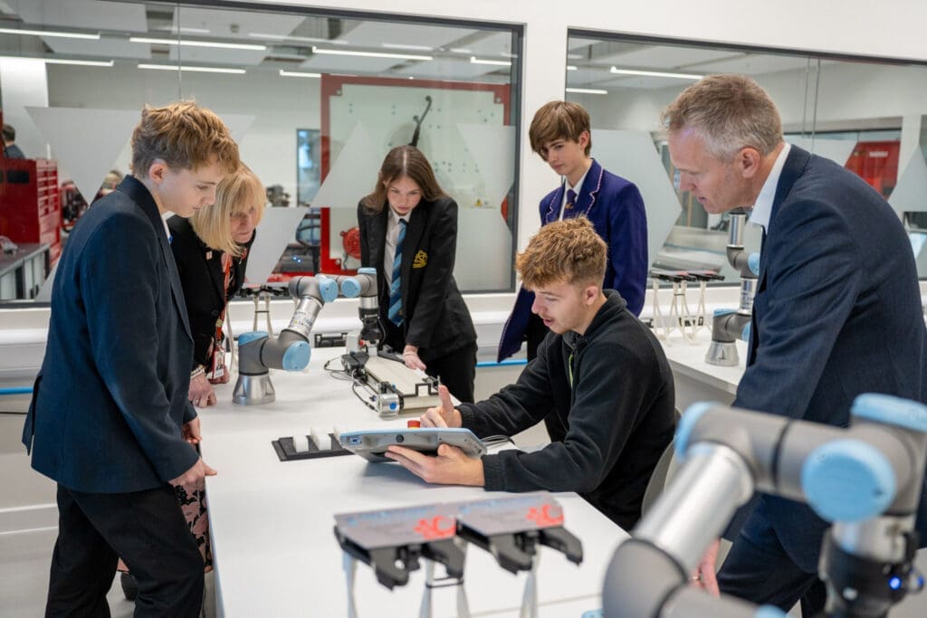 Learners using a robotic arm