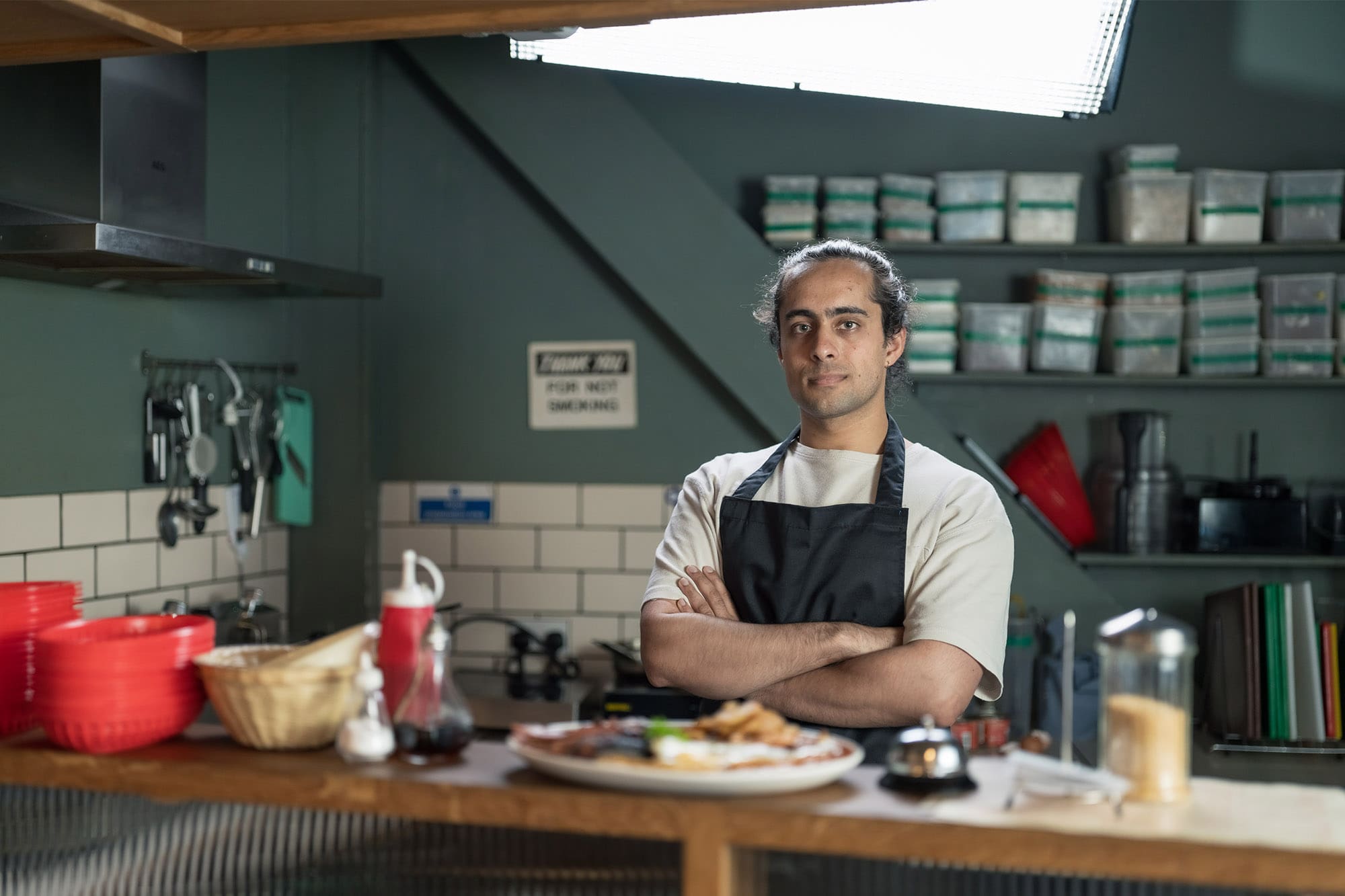 Chef stood in cafe kitchen