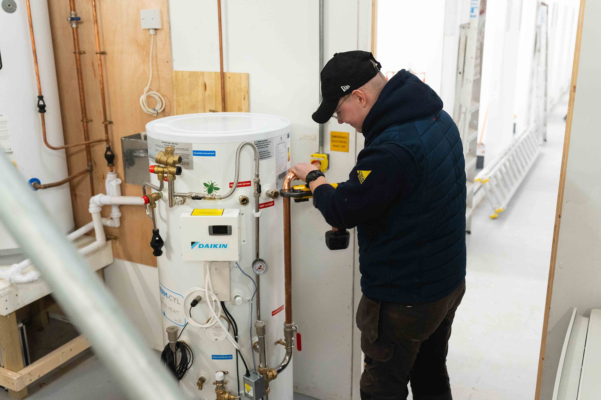 Student installing heat pump