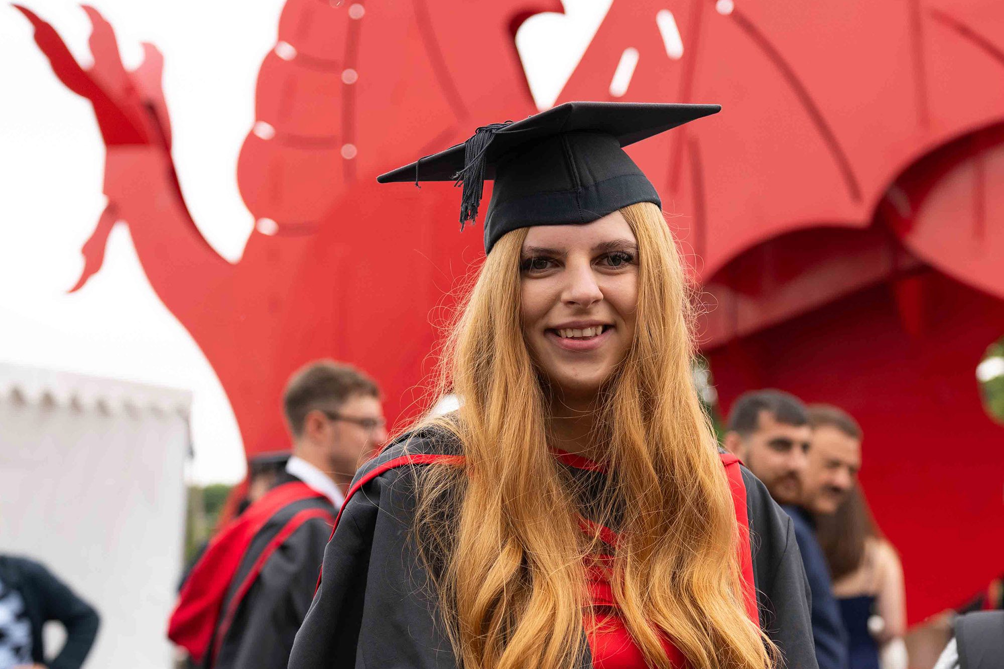 Student in cap and gown at graduation
