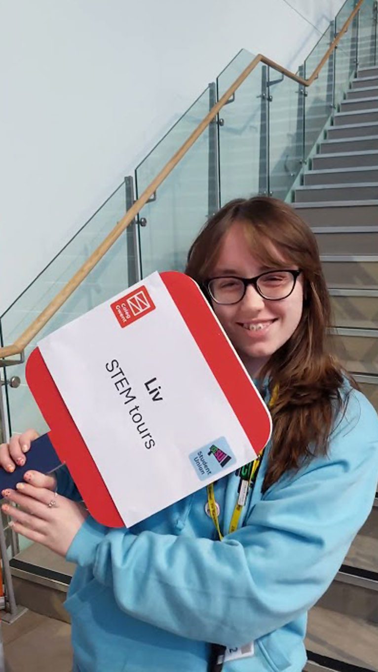 CGSU member Cory holding a sign at an open event