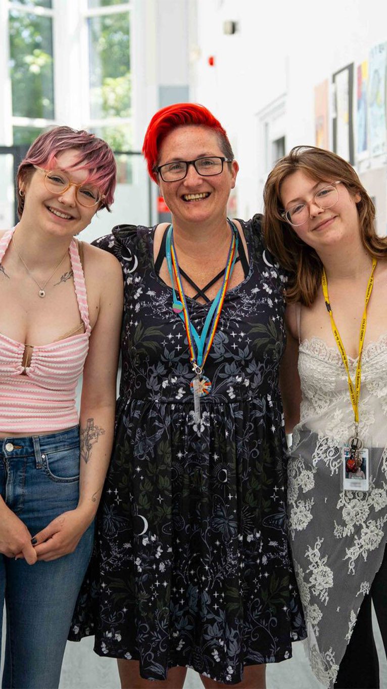 Smiling tutor with students