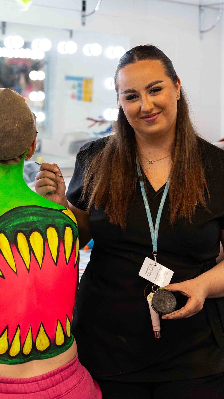 Student working on body art